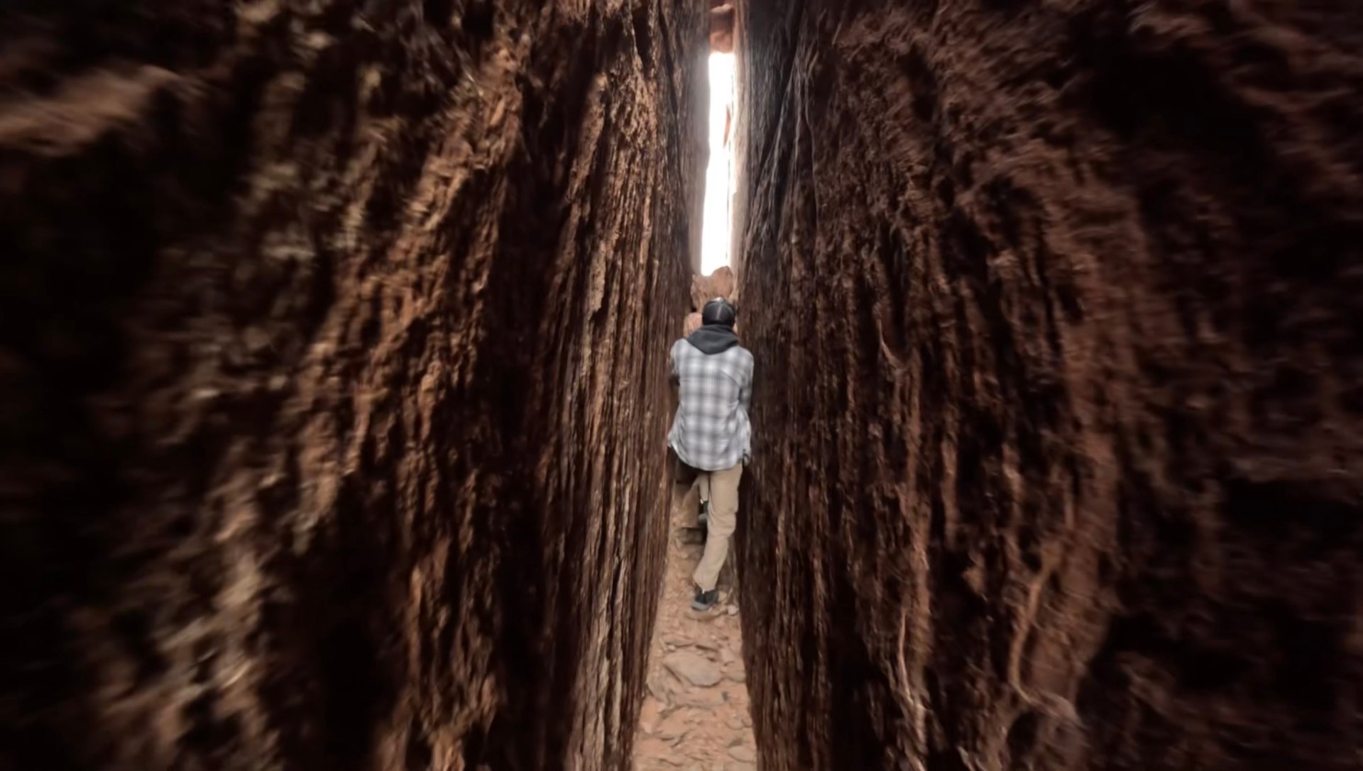 Squeezing through a narrow slot canyon