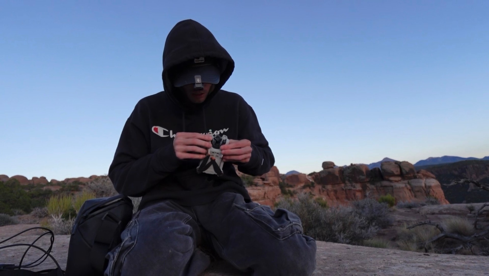 Assembling the drone at dusk above the desert